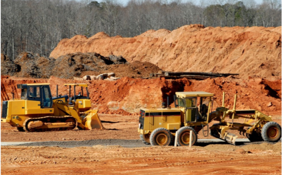 Construction site with front loaders pushing dirt